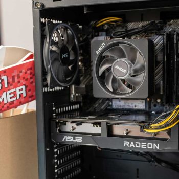Close-up of gaming computer interior with cooling fan and graphics card.